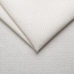 Soft white textured fabric for upholstery and home decor.