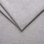 Light grey textured upholstery fabric for furniture and home decor.