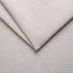 Soft beige textured fabric for upholstery or home decor.