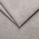 Soft beige woven fabric upholstery for furniture and home decor.