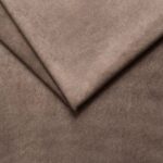 Close-up of beige fabric upholstery for furniture and home decor.
