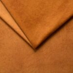 Soft brown velvet upholstery fabric for furniture and home decor.